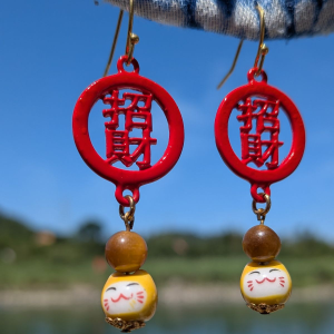 Hook earrings featuring red fortune piece that reads 招財, with Tiger's Eye beads and small yellow Maneki Neko lucky cats below